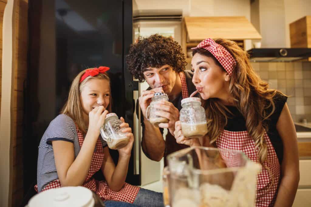 A family is sipping their cold drinks after moving in.