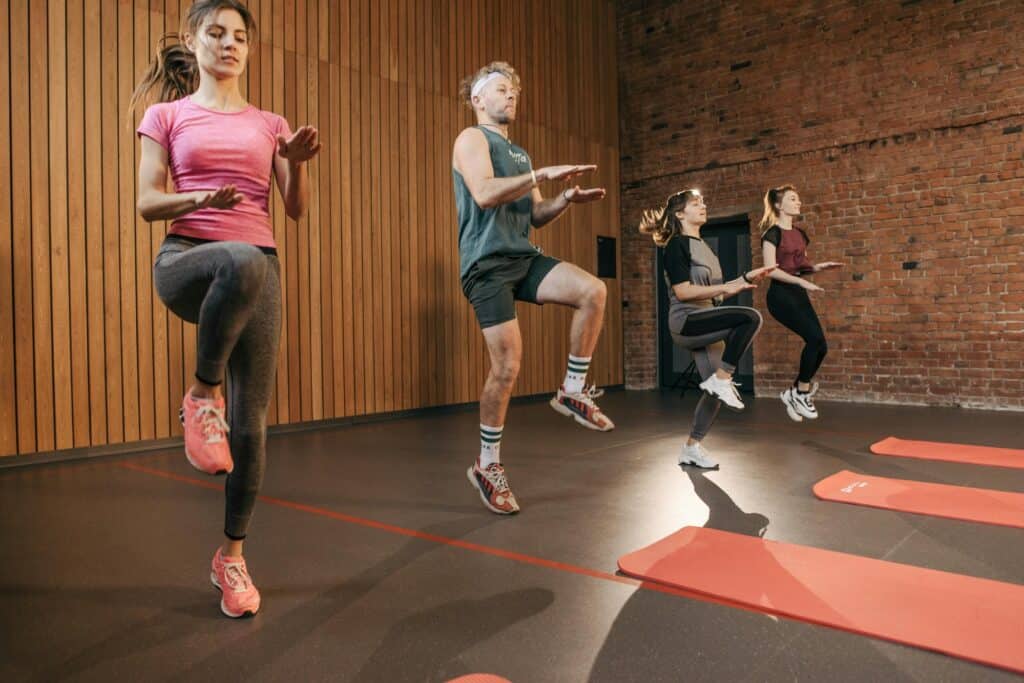 A group of people inside a fitness centre.