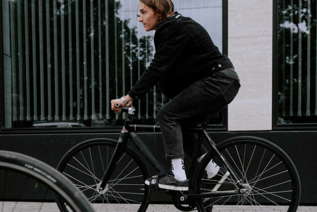 A man is riding his bike to the office